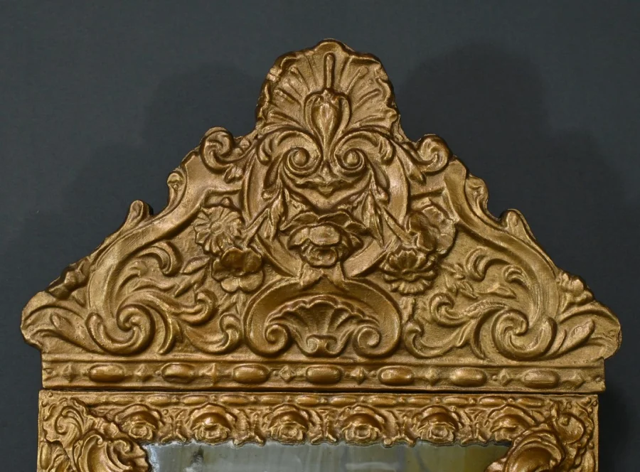 MIRROR IN REPOUSSE BRASS