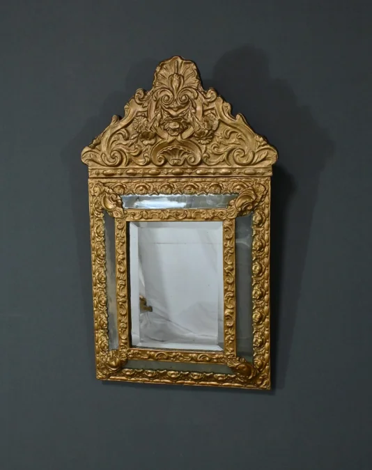 MIRROR IN REPOUSSE BRASS