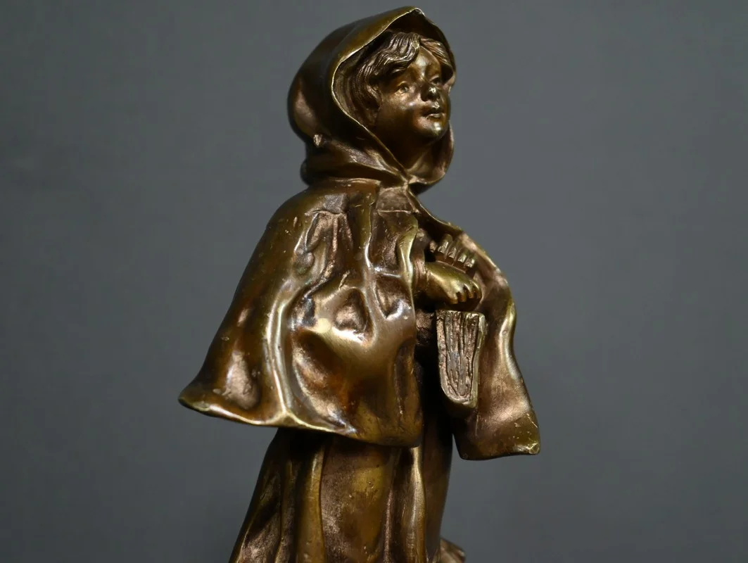 Bronze « L’Ecolière », signé Tremo – Début XXe
