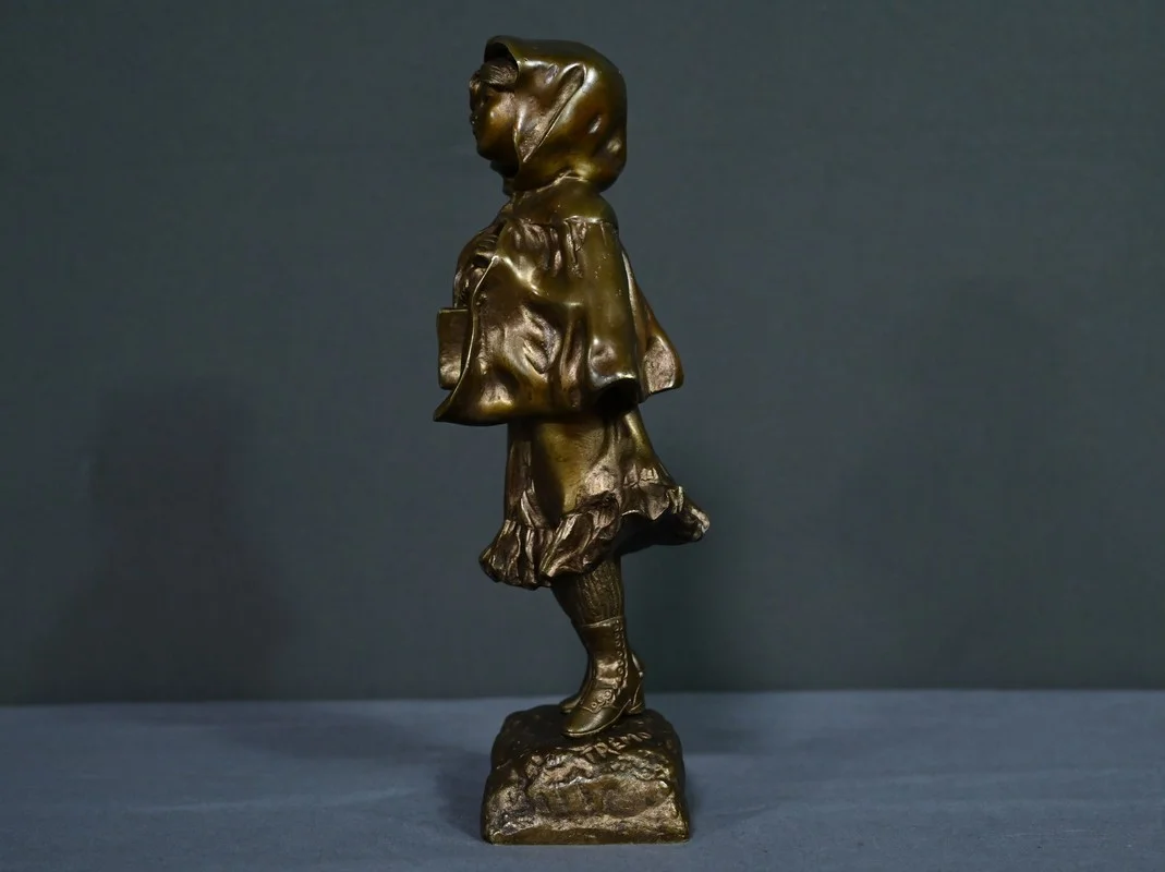 Bronze « L’Ecolière », signé Tremo – Début XXe