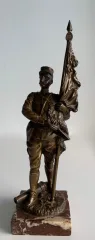BRONZE FIGURE OF A FIRST WORLD WAR SOLDIER